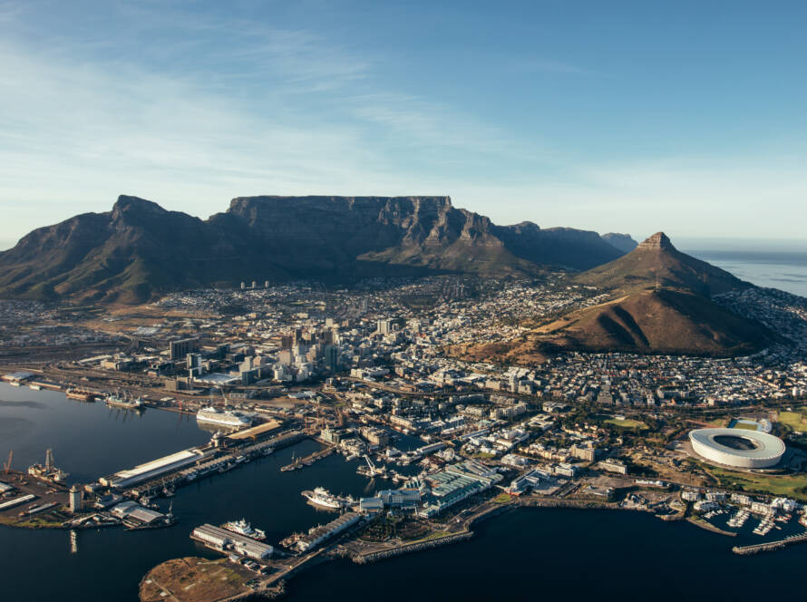 Aerial coastal view of cape town city with table mountain, cape town harbour, lions head and devils peak, South africa.