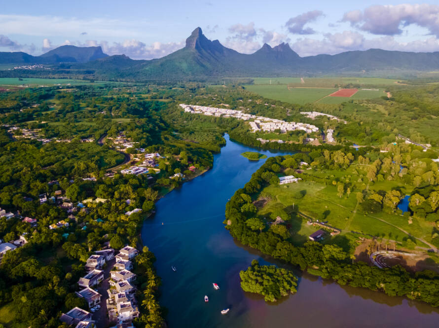fishing boats resting at tamarin bay, Mauritius island, indian ocean, Africa with Tamarin mountain on the background